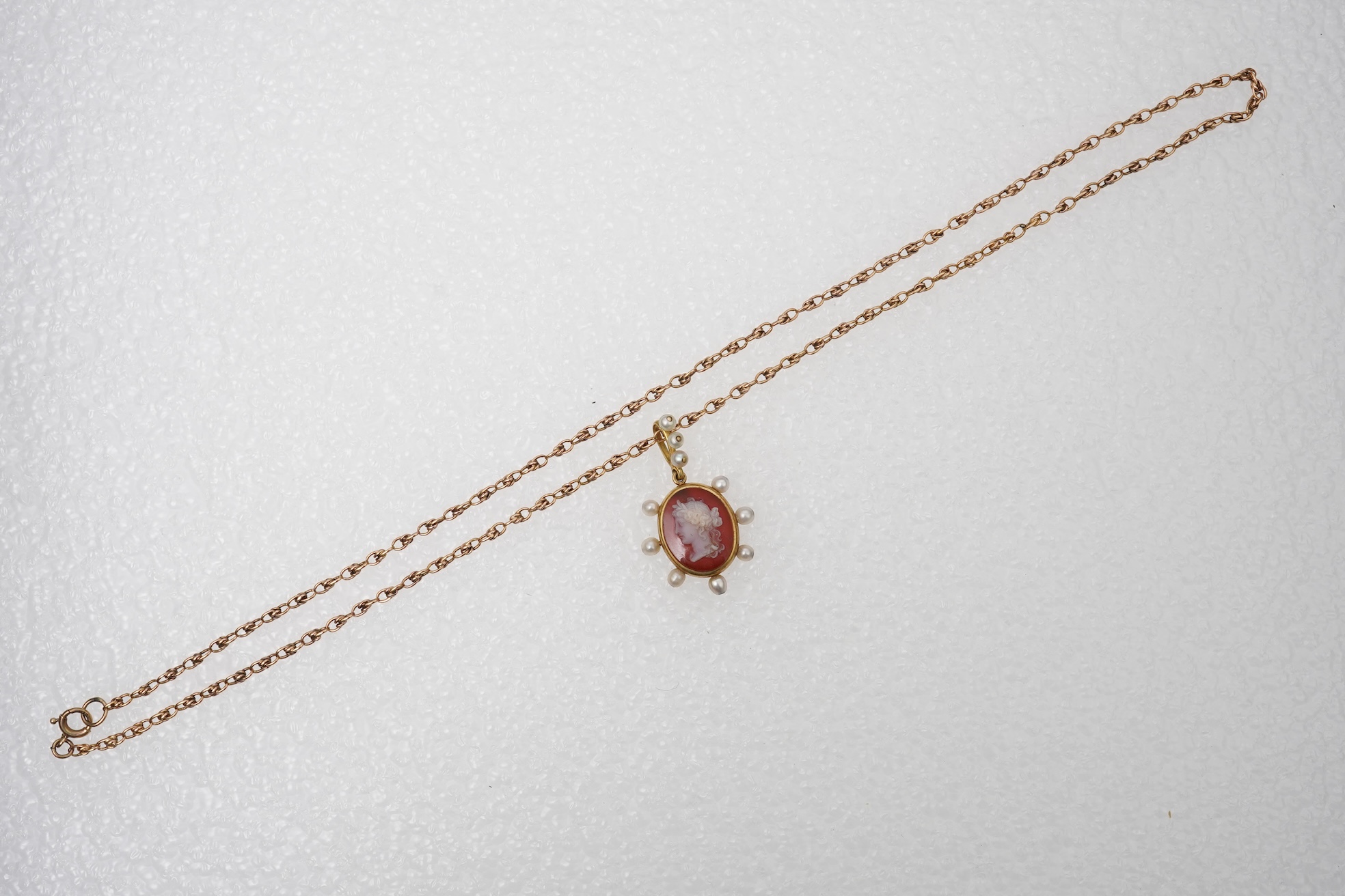 A late Victorian hardstone cameo and pearl pendant, late 19th century